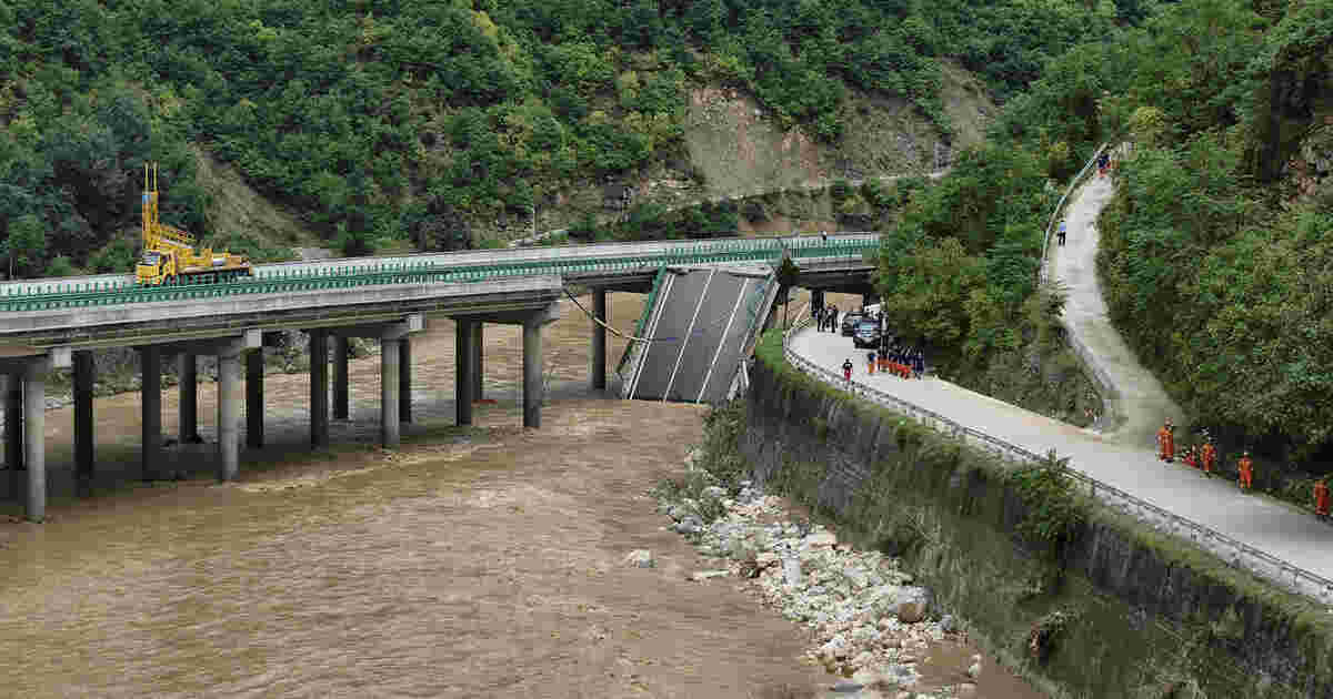 At least 11 dead, dozens missing after a highway bridge in China collapses after heavy storms