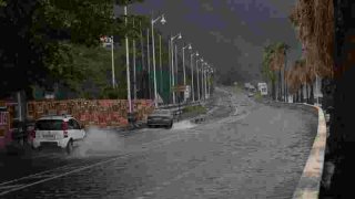 Tropical Storm Ernesto nears hurricane strength as it skirts Puerto Rico, bringing power outages and potential flooding