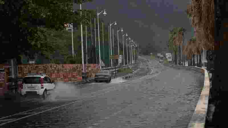 Tropical Storm Ernesto nears hurricane strength as it skirts Puerto Rico, bringing power outages and potential flooding